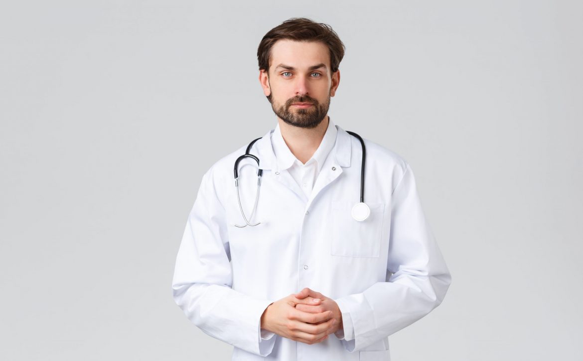 hospital-healthcare-workers-covid-19-treatment-concept-young-doctor-scrubs-making-daily-errands-clinic-listening-patient-symptoms-look-camera-professional-physician-curing-diseases (1)