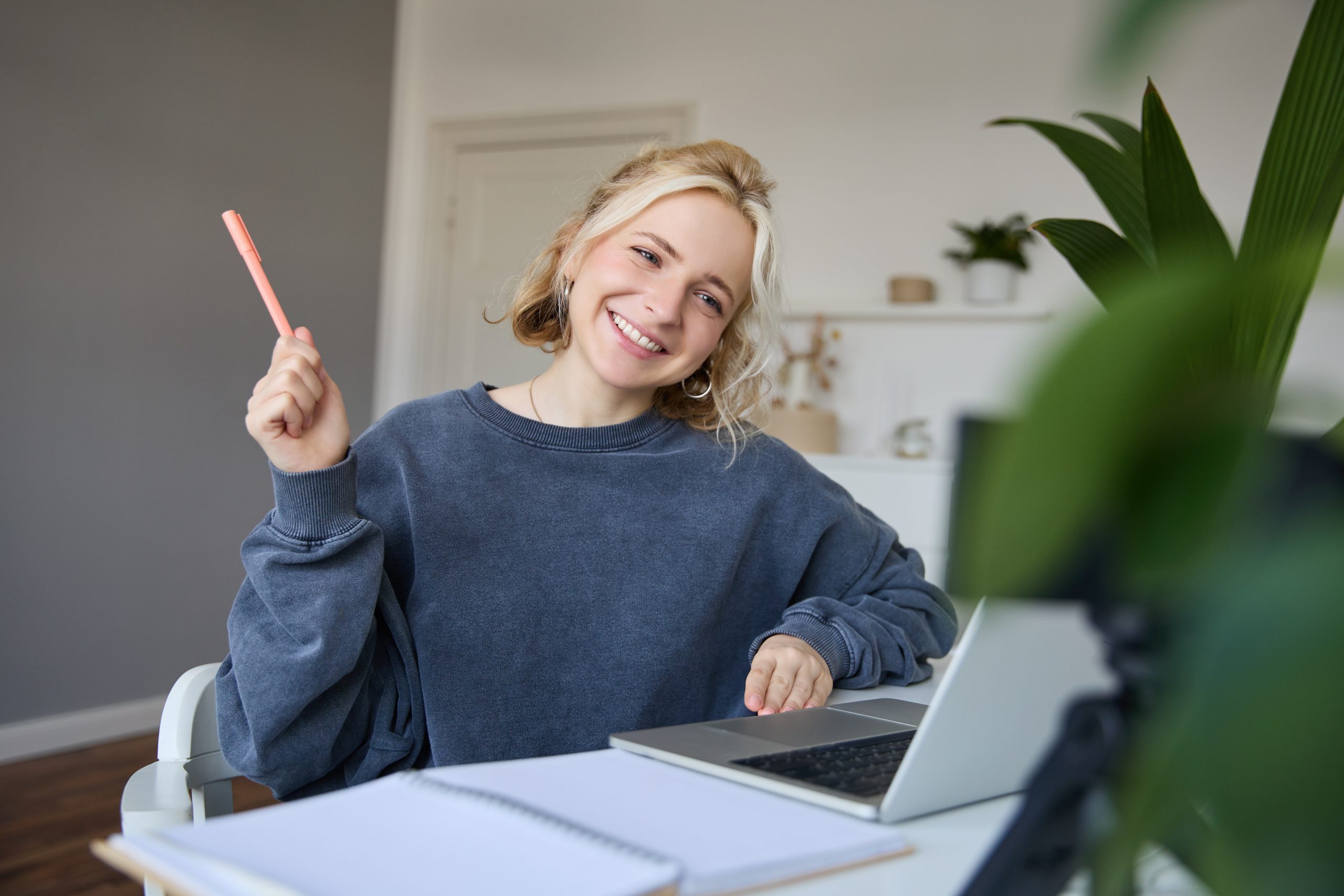 portrait-young-smiling-woman-student-talking-teacher-online-via-video-chat-doing-course-scaled.jpg